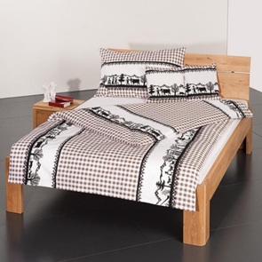 Eidgenuss Bettwäsche in der Farbe taupe mit schönem Scherenschnitt-Motiv auf feinem Karodessin