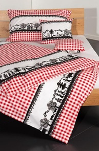 Eidgenuss Bettwäsche in der Farbe rot mit schönem Scherenschnitt-Motiv auf feinem Karodessin